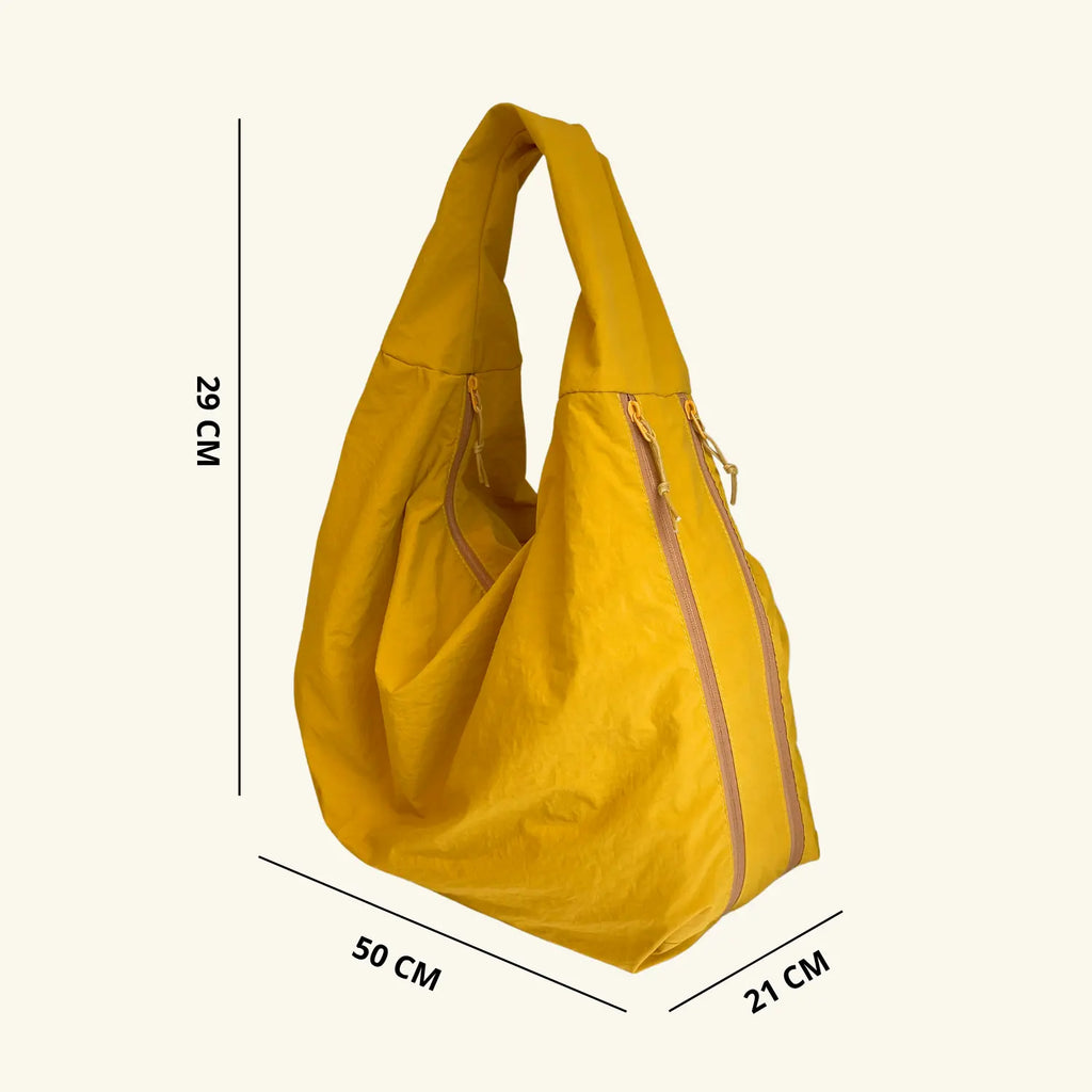 Lumi Tote - WB0165 - Bolsa estilo hobo amplia, ligera y funcional con compartimentos ocultos y textura suave al tacto