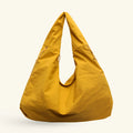 Lumi Tote - WB0165 - Bolsa estilo hobo amplia, ligera y funcional con compartimentos ocultos y textura suave al tacto